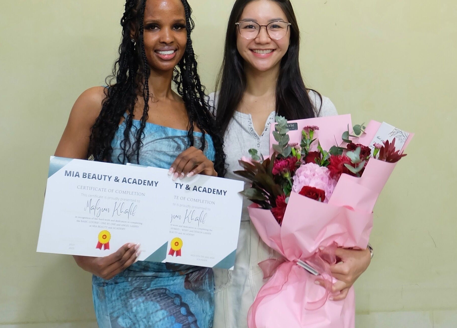 Graduates with certificates at MIA Beauty & Academy, Thành phố Hồ Chí Minh, VN, smiling proudly.