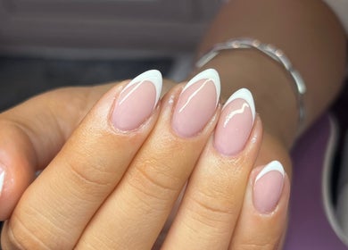 French manicure by Nails By Molly in Maxey, England, GB showcases glossy, white-tipped nails.