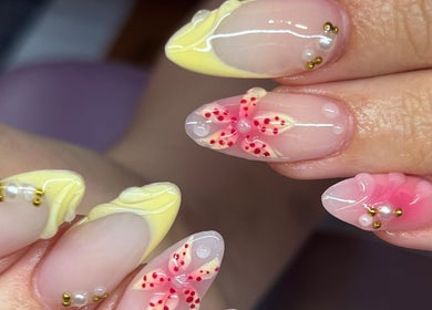 Elegant floral nail art at Nails By Molly in Maxey, England, GB, featuring intricate gel designs and embellishments.
