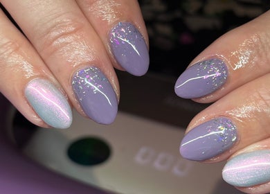 Stylish lavender glitter nails by Nails By Molly, Maxey, England, GB. Perfect for a chic look.