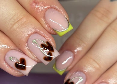 Stylish nail art featuring heart design at Nails By Molly, Maxey, England, GB.
