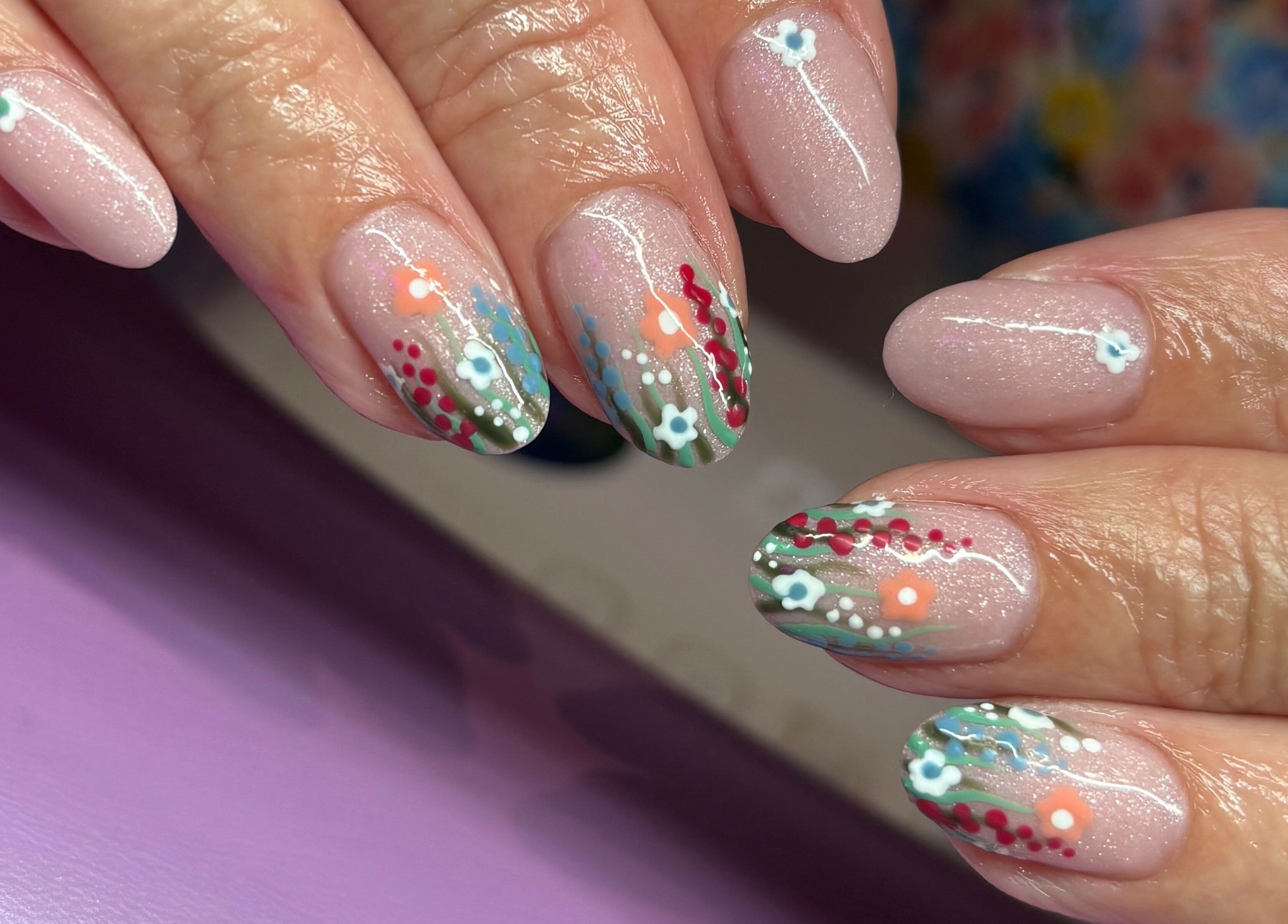 Floral nail art by Nails By Molly in Maxey, England, GB, featuring intricate flower designs on pink nails.