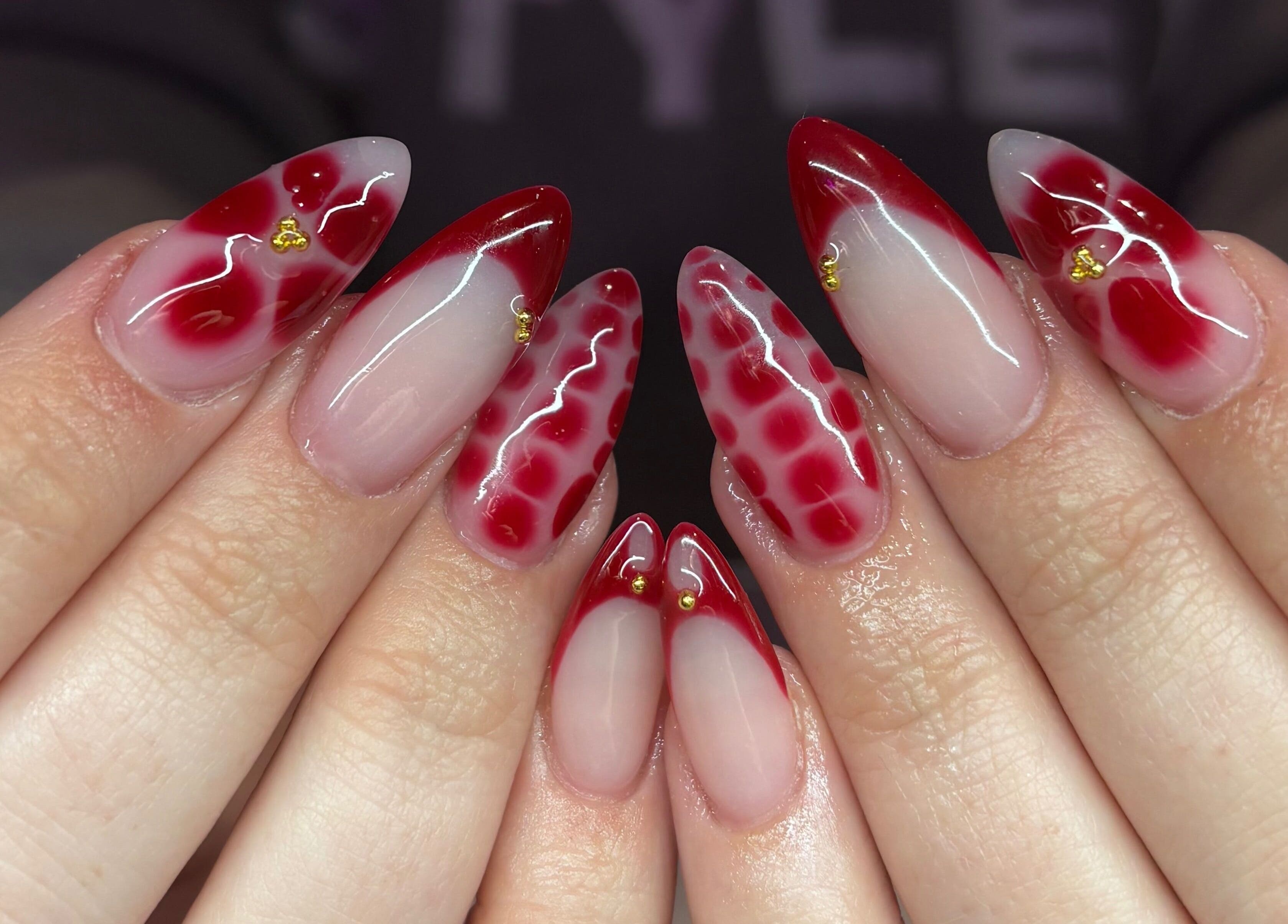 Stylish red and clear acrylic nails at Nails By Molly, Maxey, England, GB.