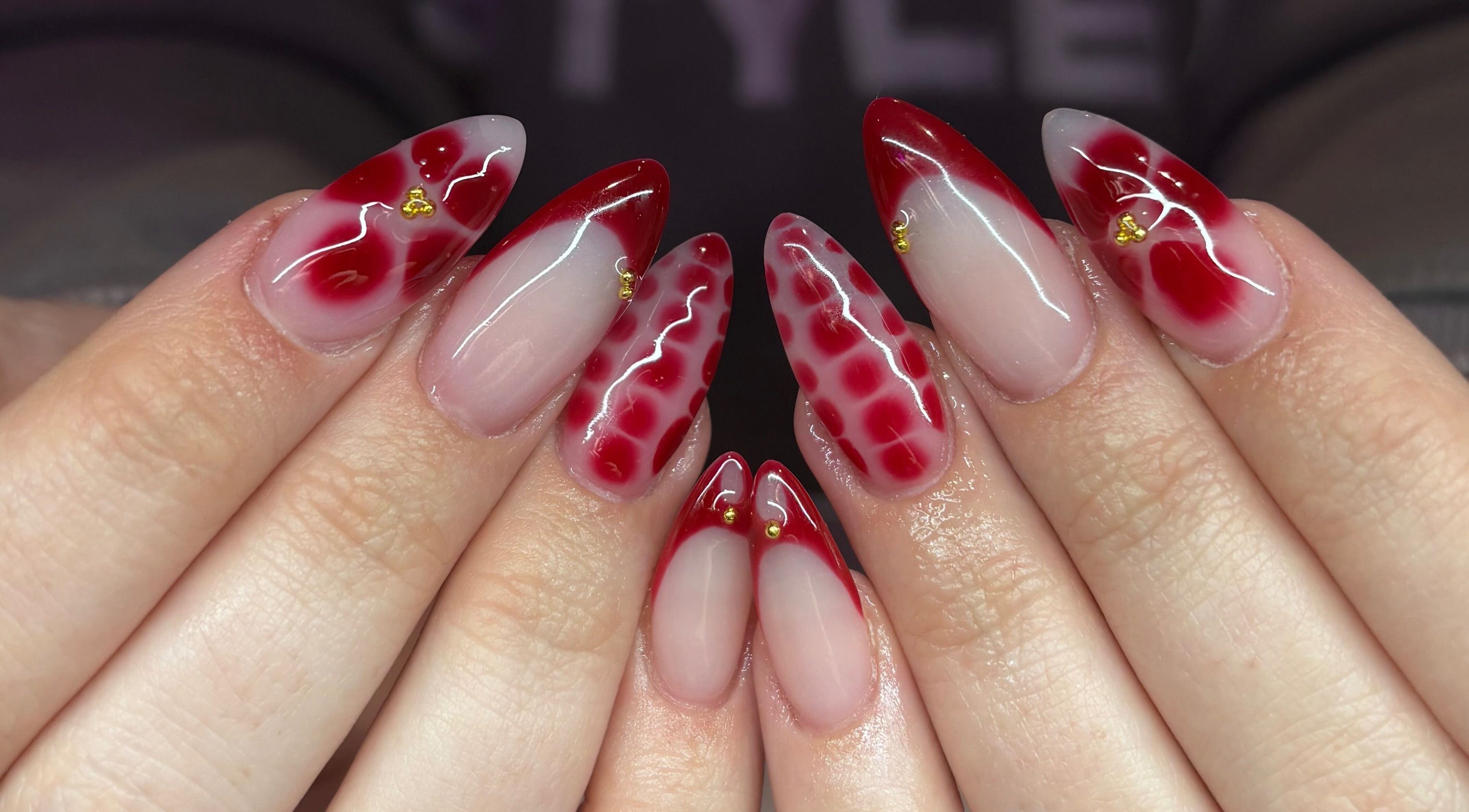 Stylish red and clear acrylic nails at Nails By Molly, Maxey, England, GB.