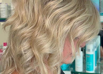 Stylish blonde waves styled at Premier Hair Centre, Toronto, Ontario, CA. Transformative hair care available.