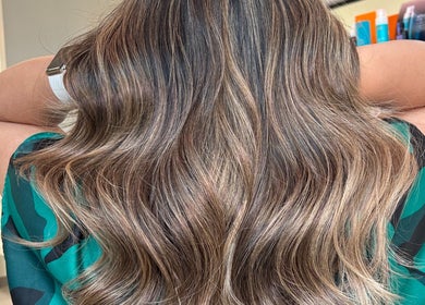 Soft, wavy hairstyle at Premier Hair Centre in Toronto, Ontario, CA, showcasing expert highlights and styling.