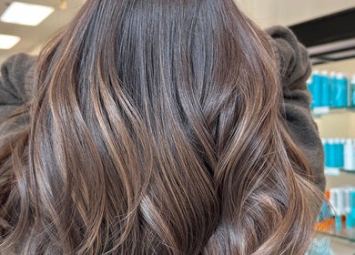 Lustrous hair waves styled at Premier Hair Centre, Toronto, Ontario, CA, showcasing vibrant tones.