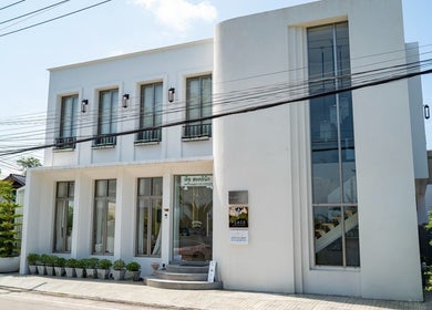 Front view of Warin Spa วารินสปา, a modern white building in Chang Wat Tak, Chang Wat Tak, TH.