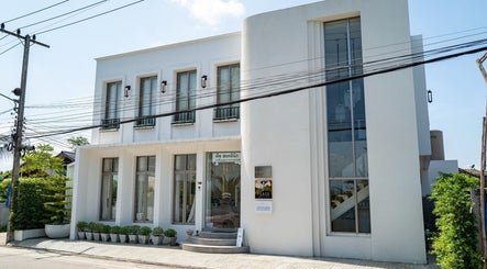 Front view of Warin Spa วารินสปา, a modern white building in Chang Wat Tak, Chang Wat Tak, TH.