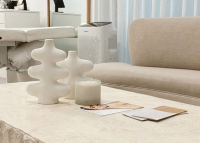 Stylish, serene lounge area at Queen Brows and Skin, Melbourne, Victoria, AU, showcasing a modern, inviting space.