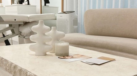 Stylish, serene lounge area at Queen Brows and Skin, Melbourne, Victoria, AU, showcasing a modern, inviting space.