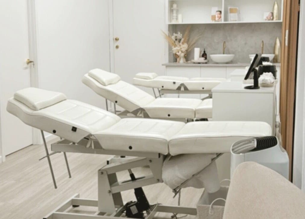 Serene treatment room at Queen Brows and Skin - Doncaster East, Melbourne, Victoria, AU with plush reclining chairs.