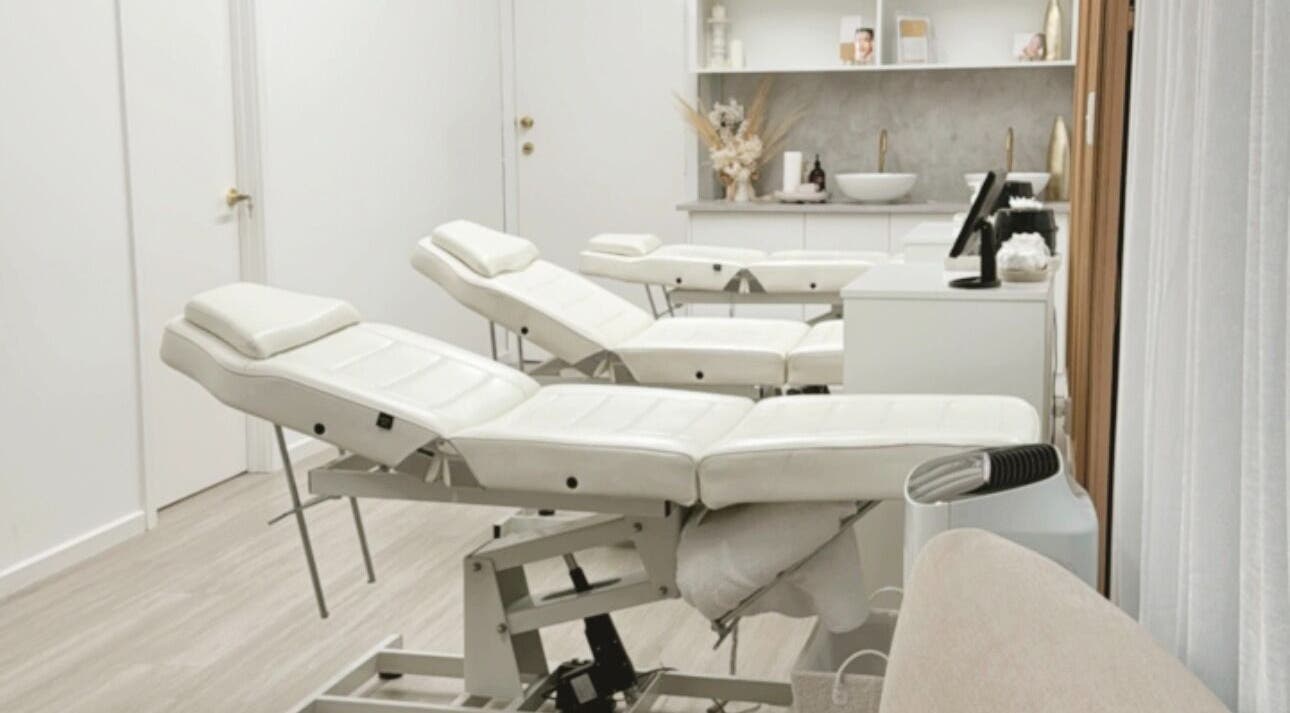 Serene treatment room at Queen Brows and Skin - Doncaster East, Melbourne, Victoria, AU with plush reclining chairs.