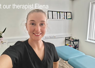 Therapist at LG Holistic in Limerick, County Limerick, IE, smiling in a bright treatment room.
