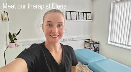Therapist at LG Holistic in Limerick, County Limerick, IE, smiling in a bright treatment room.