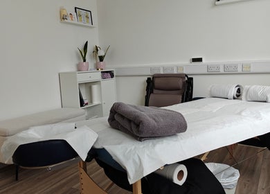 Serene therapy room at LG Holistic, Limerick, County Limerick, IE with massage table and calming decor.
