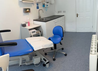 Modern treatment room at Blackrock Podiatry Clinic, Dundalk, County Louth, IE, featuring a blue chair.