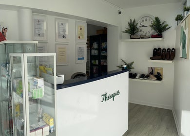 Reception area at Blackrock Podiatry Clinic, Dundalk, County Louth, IE. Features display cabinet and cozy decor.