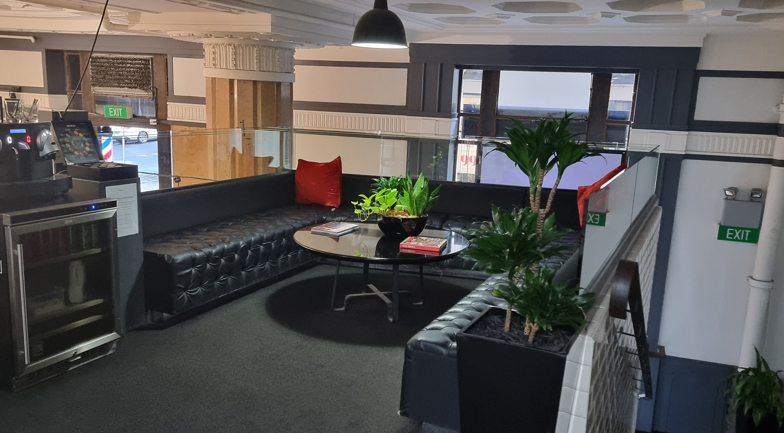 Elegant waiting area at Hava & Co, Auckland, NZ, featuring plush seating and modern decor.