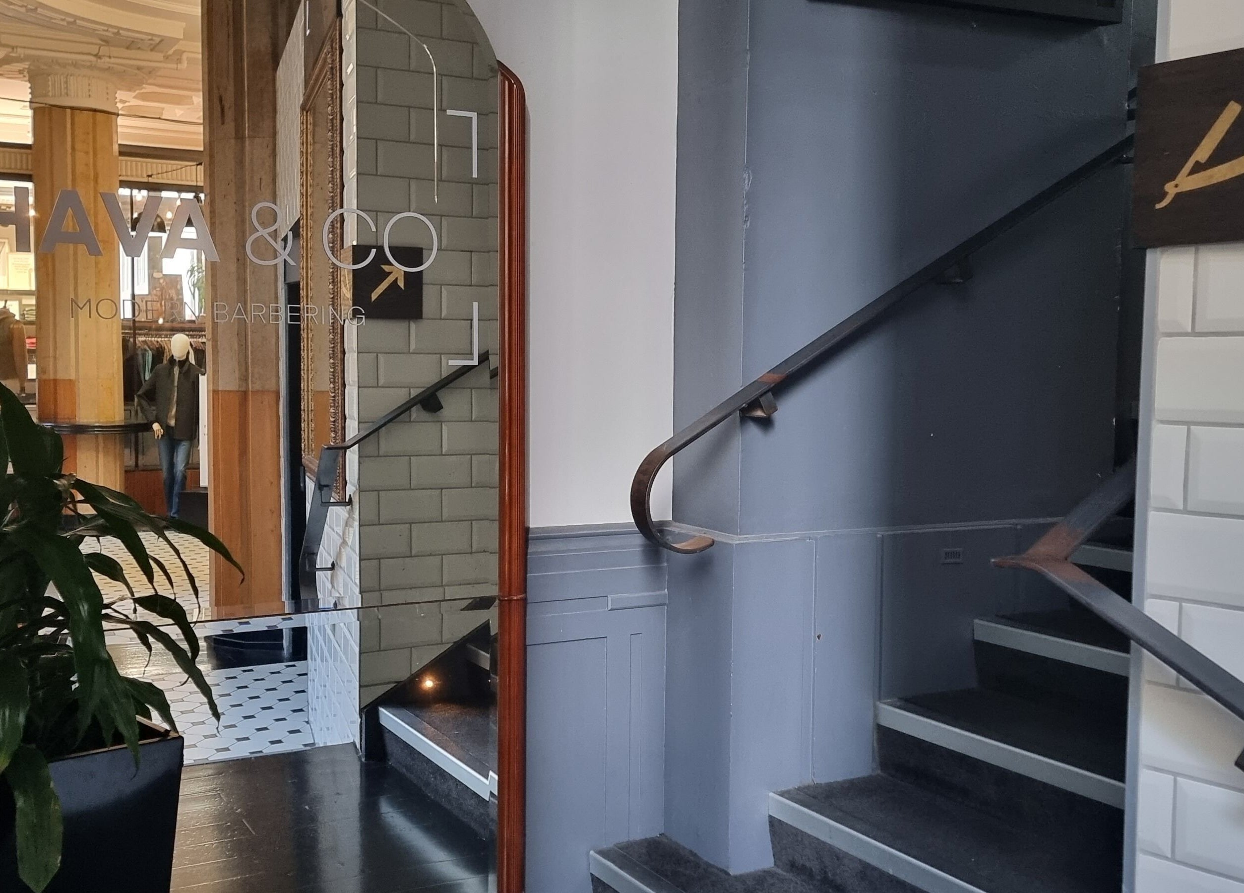Sophisticated entrance of Hava & Co, Auckland, NZ with stylish stairs and modern decor.