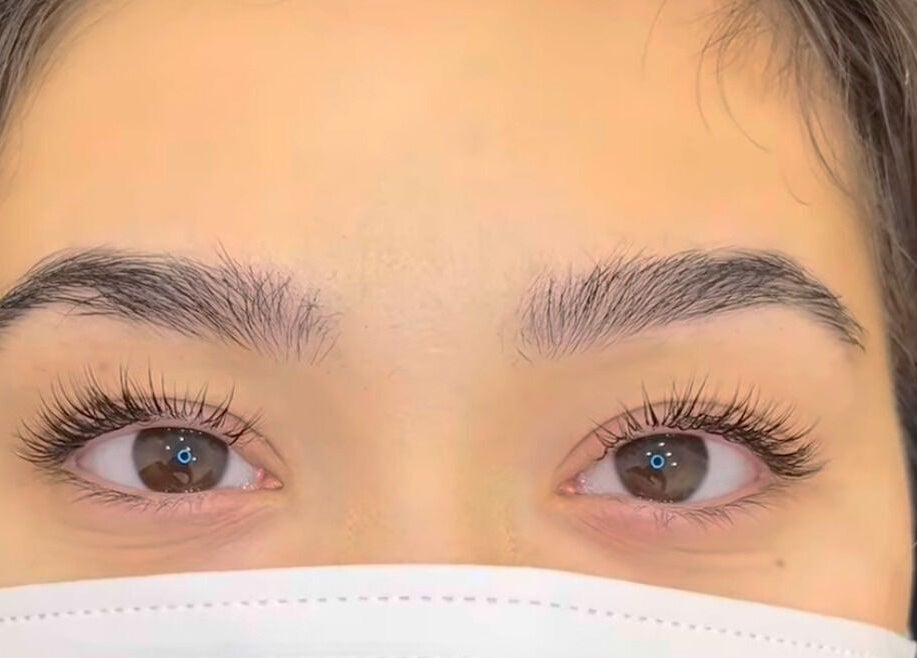 Close-up of beautifully enhanced lashes at Rm Lashes, London, England, GB, showcasing natural beauty.