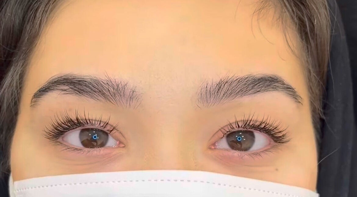 Close-up of beautifully enhanced lashes at Rm Lashes, London, England, GB, showcasing natural beauty.