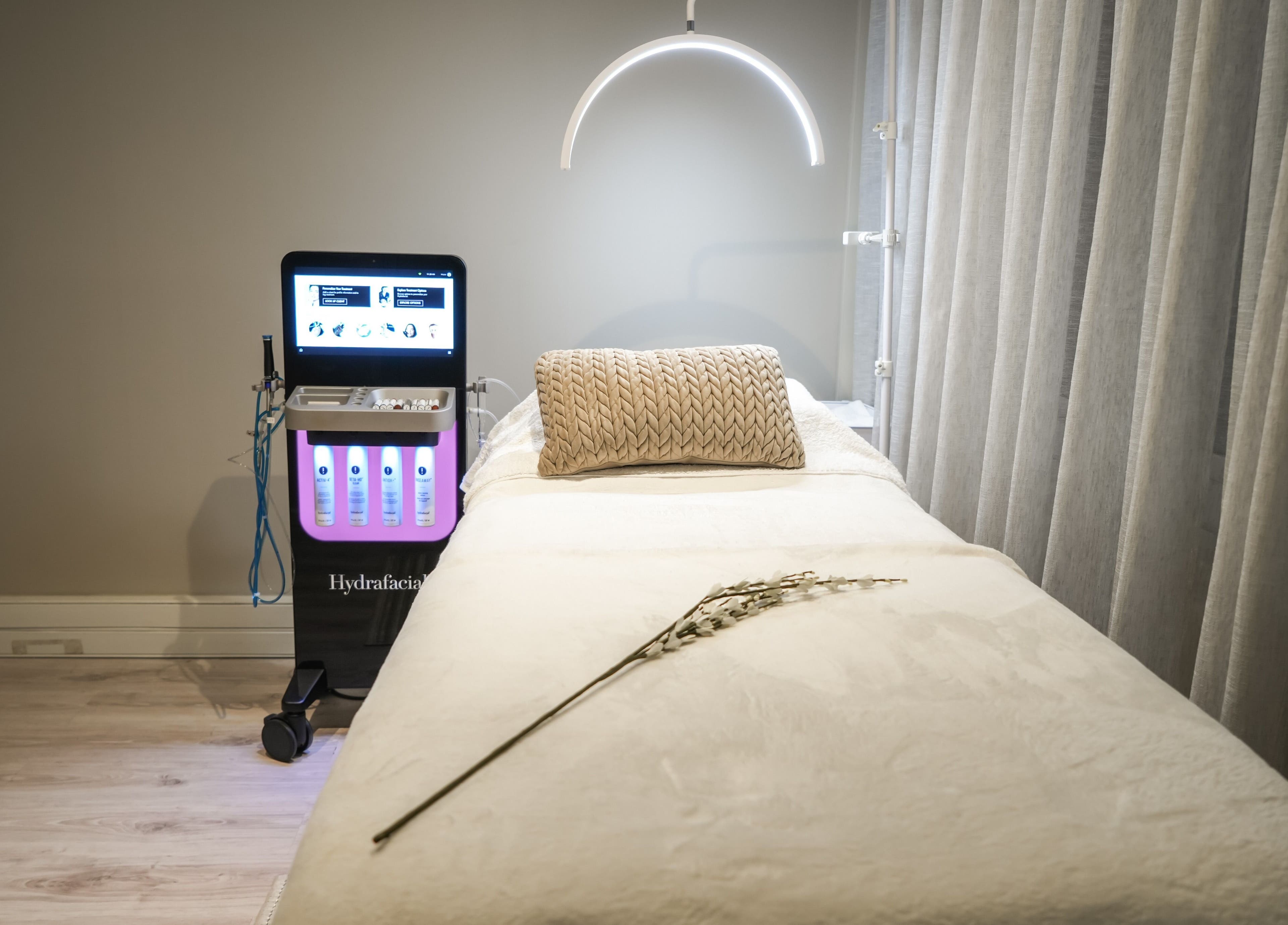 Luxurious treatment room at Novaderm Aesthetics, Cape Town, Western Cape, ZA with Hydrafacial equipment.