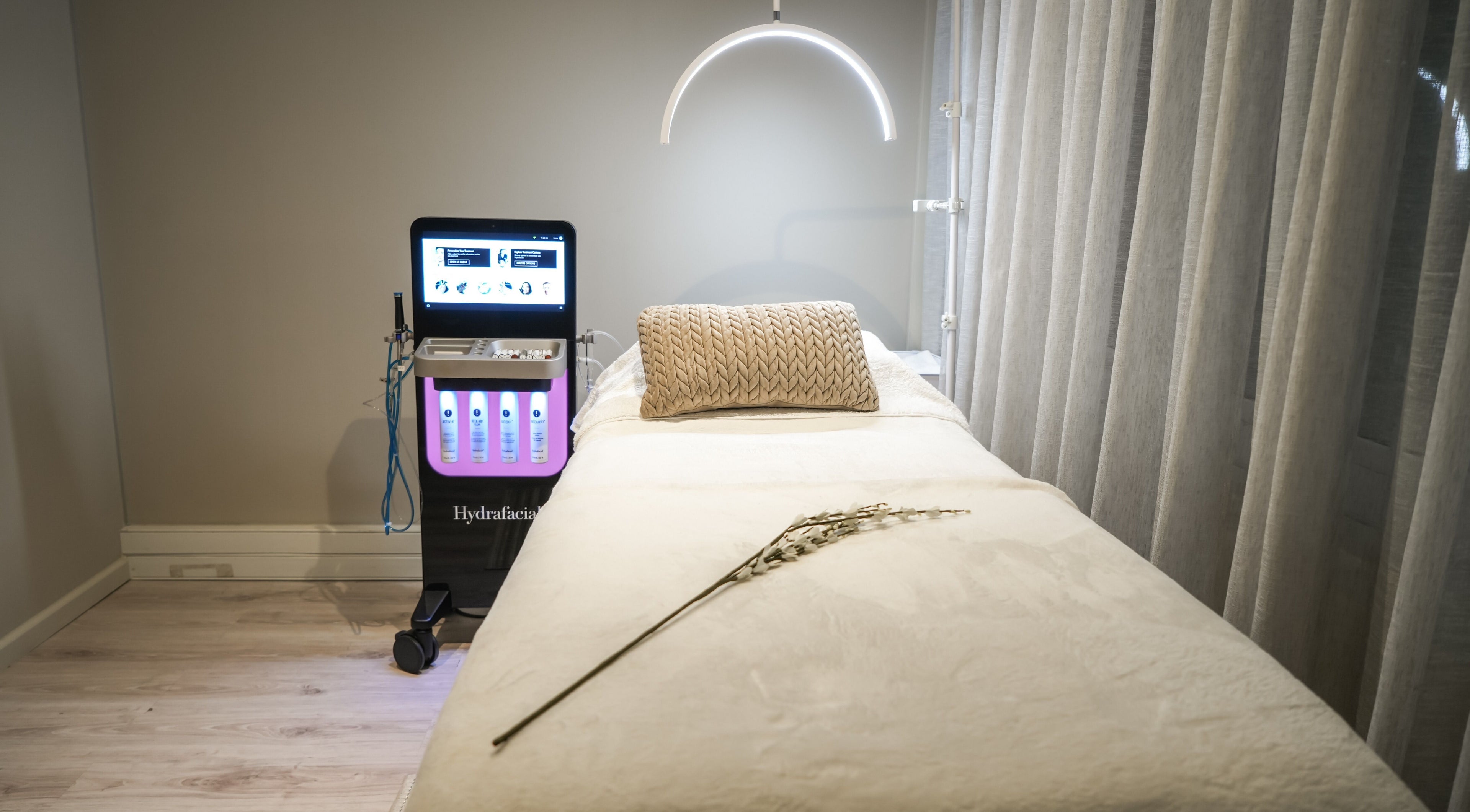 Luxurious treatment room at Novaderm Aesthetics, Cape Town, Western Cape, ZA with Hydrafacial equipment.