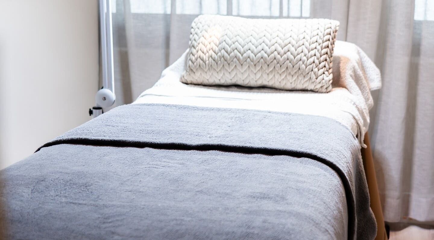 Luxurious treatment bed at Novaderm Aesthetics in Cape Town, Western Cape, ZA, perfect for relaxation.