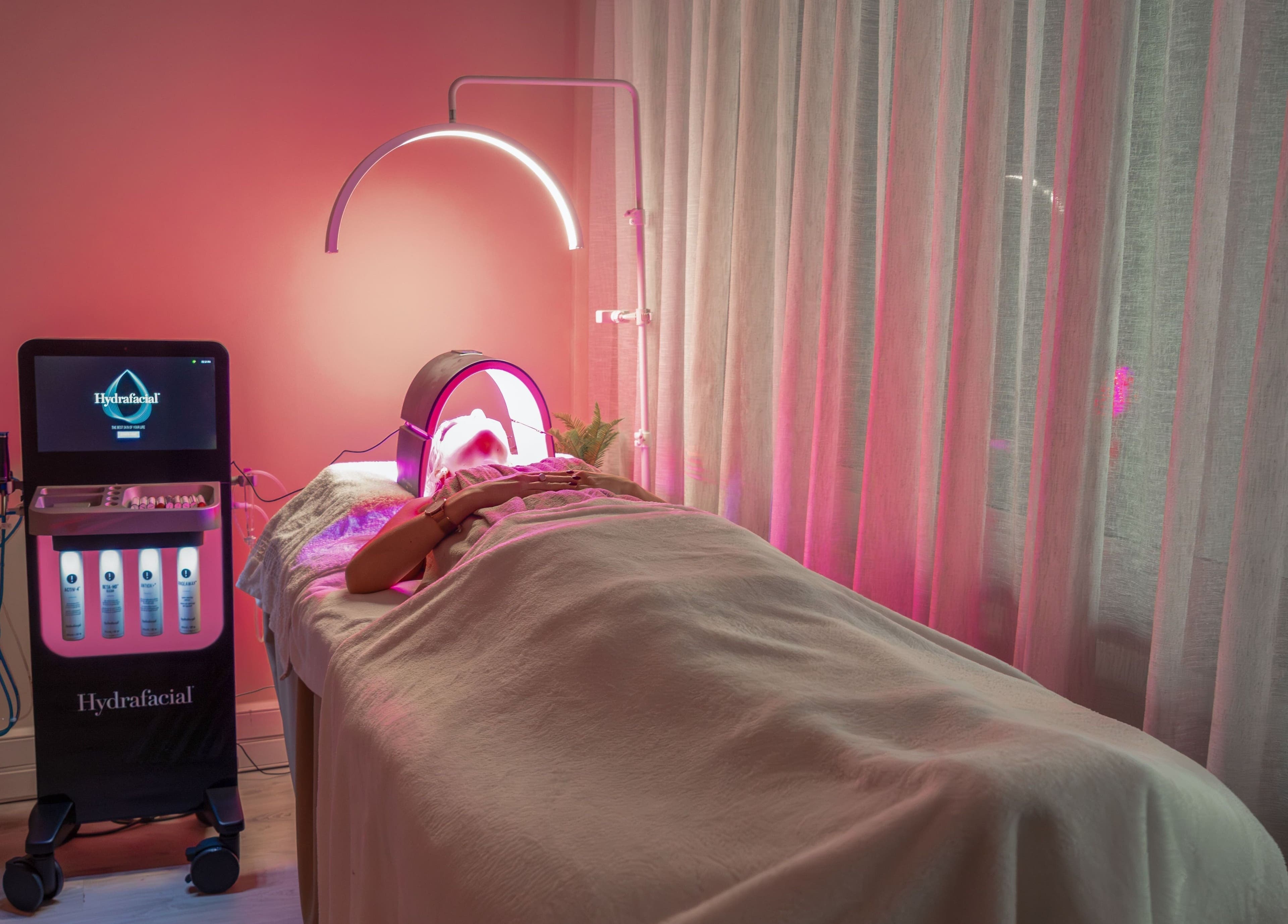 Relaxing HydraFacial treatment setup at Novaderm Aesthetics, Cape Town, Western Cape, ZA. Calm ambiance with soft lighting.