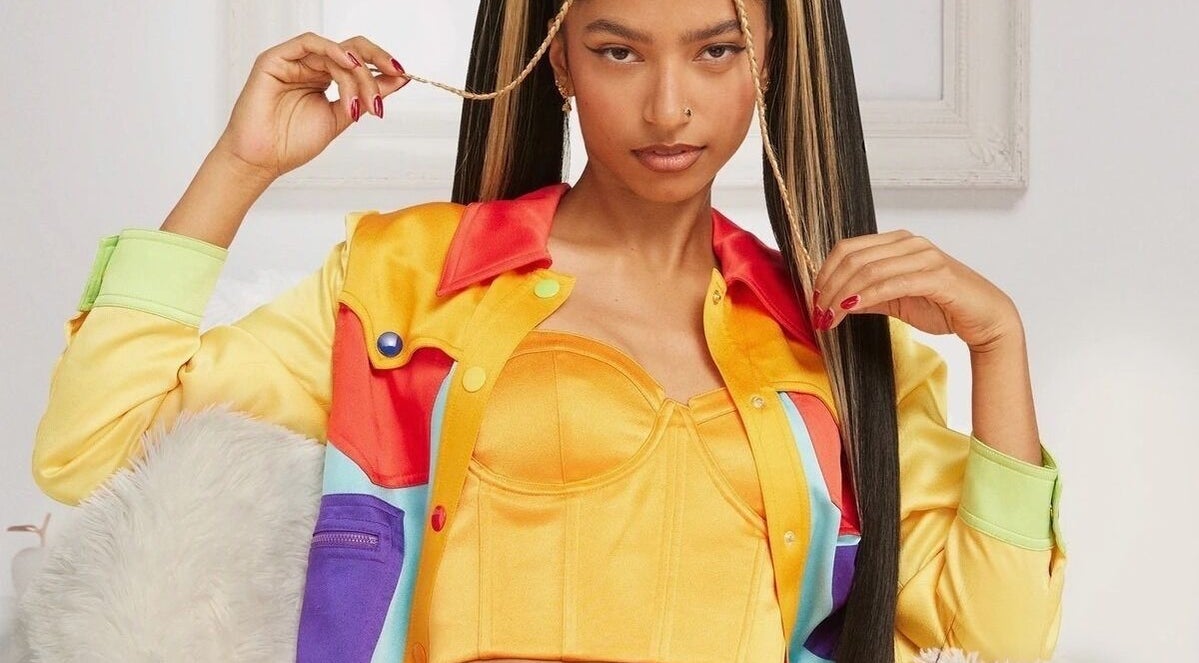 Stylish individual with colorful attire, showcasing Undivided Hair Studio, Houston, Texas, US.