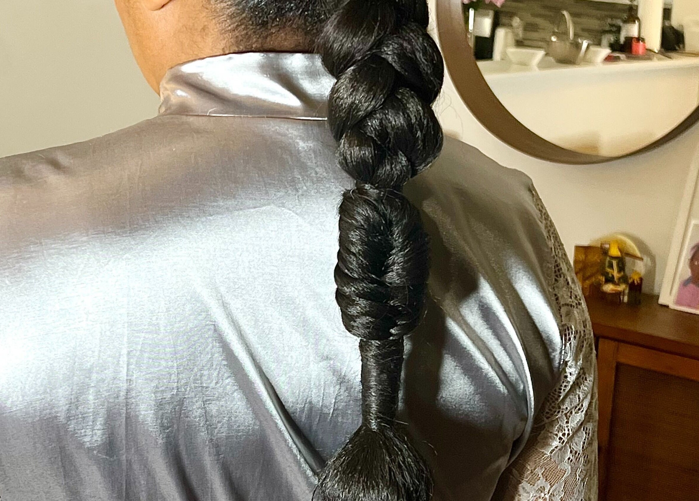Elegant braid style at Undivided Hair Studio, Houston, Texas, US, showcasing sleek hair techniques.