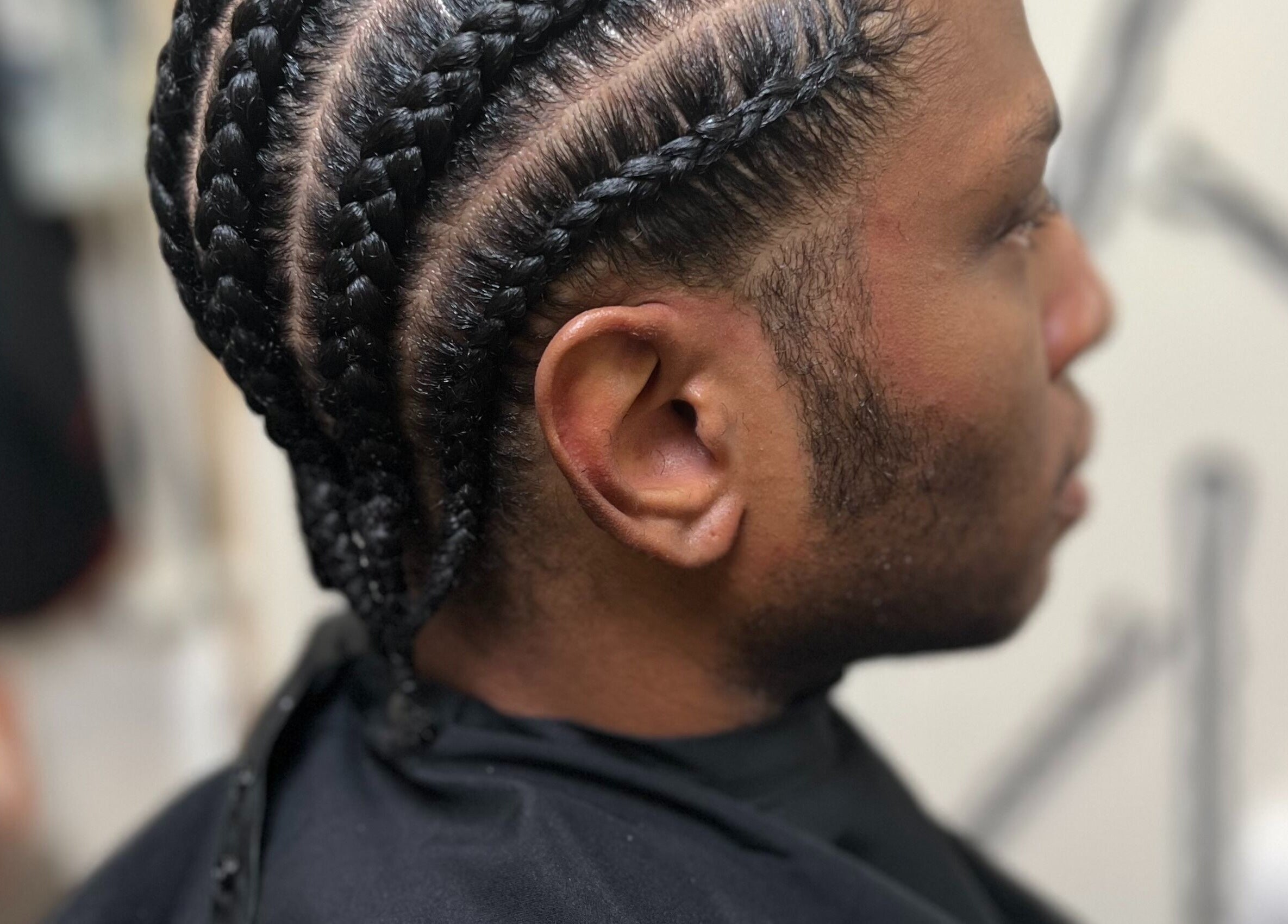 Detailed braids styled at Undivided Hair Studio, Houston, Texas, US, showcasing expert craftsmanship.