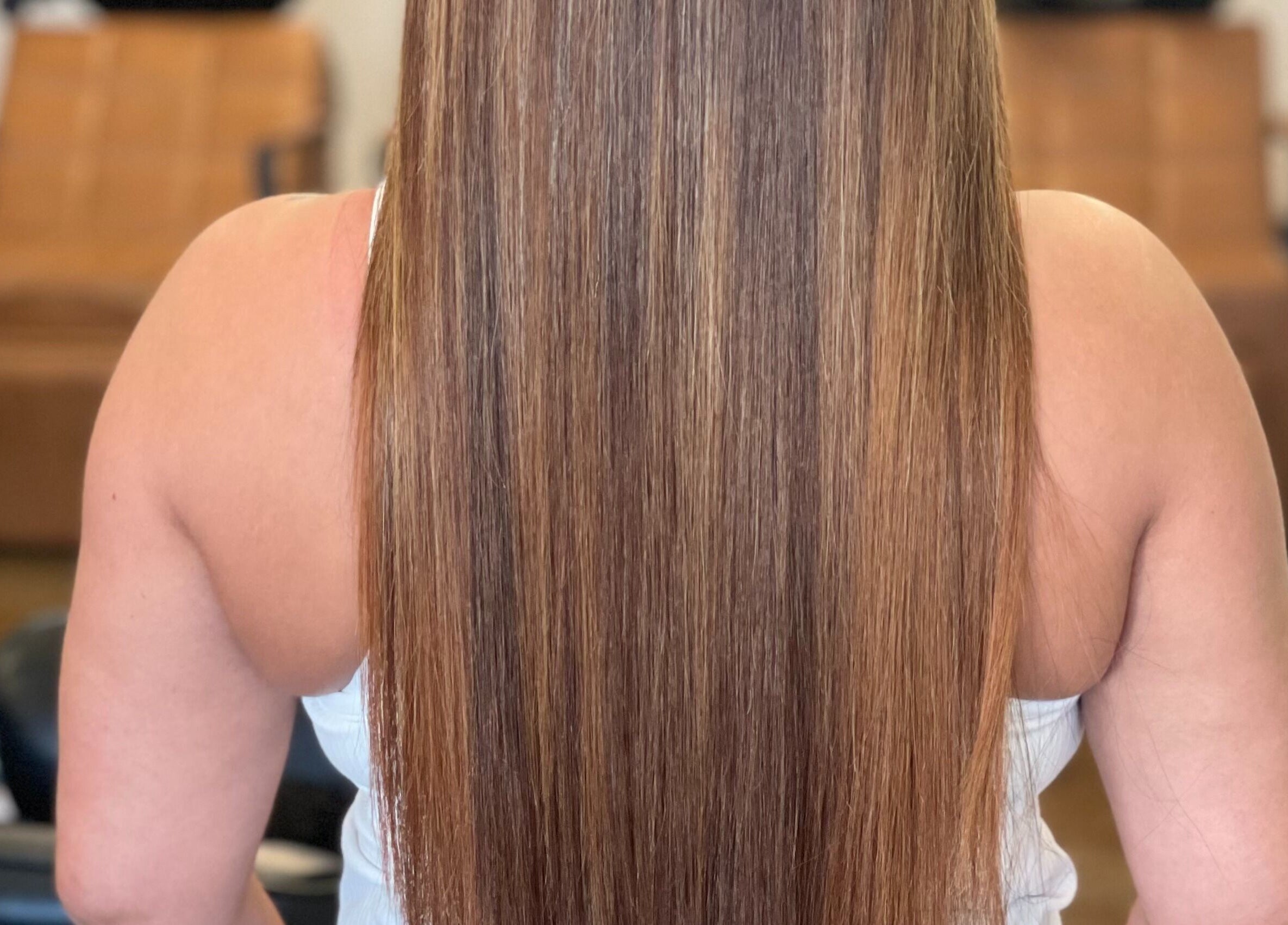 Smooth, straight hair styled at Undivided Hair Studio in Houston, Texas, US. Elegant beauty in hair care.