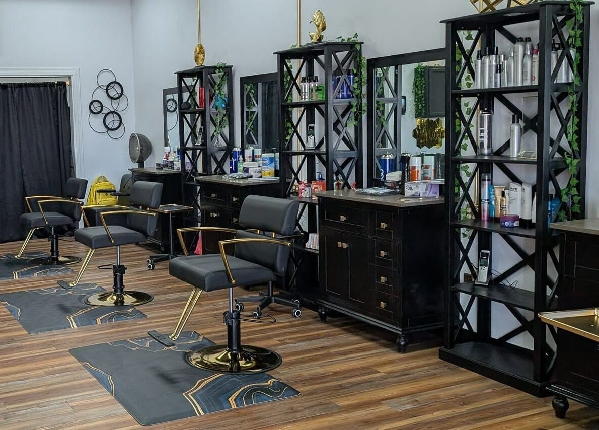 Chic interior of Legacy Salon in Warrensburg, Missouri, US featuring stylish black chairs and beauty products.