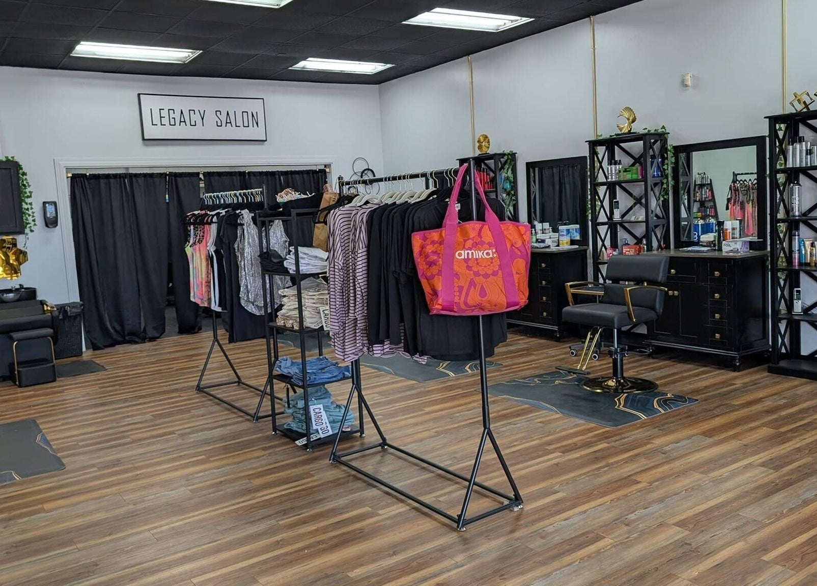 Modern interior of Legacy Salon in Warrensburg, Missouri, showcasing stylish decor and beauty products.