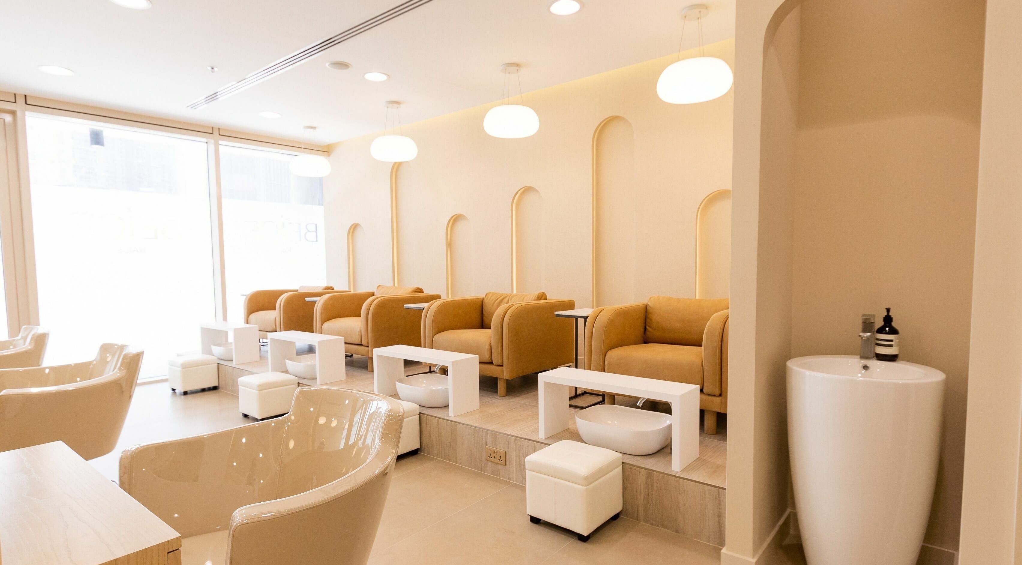 Beige Beauty Salon's elegant interior with plush chairs in Dubai, Dubai, AE.