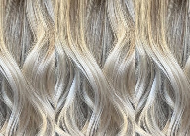Elegant blonde waves styled at KG Hair, Newport, Wales, GB, showcasing a luxurious finish.