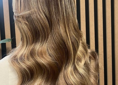Elegant wavy hairstyle at KG Hair, Newport, Wales, GB. A warm, inviting hair salon.
