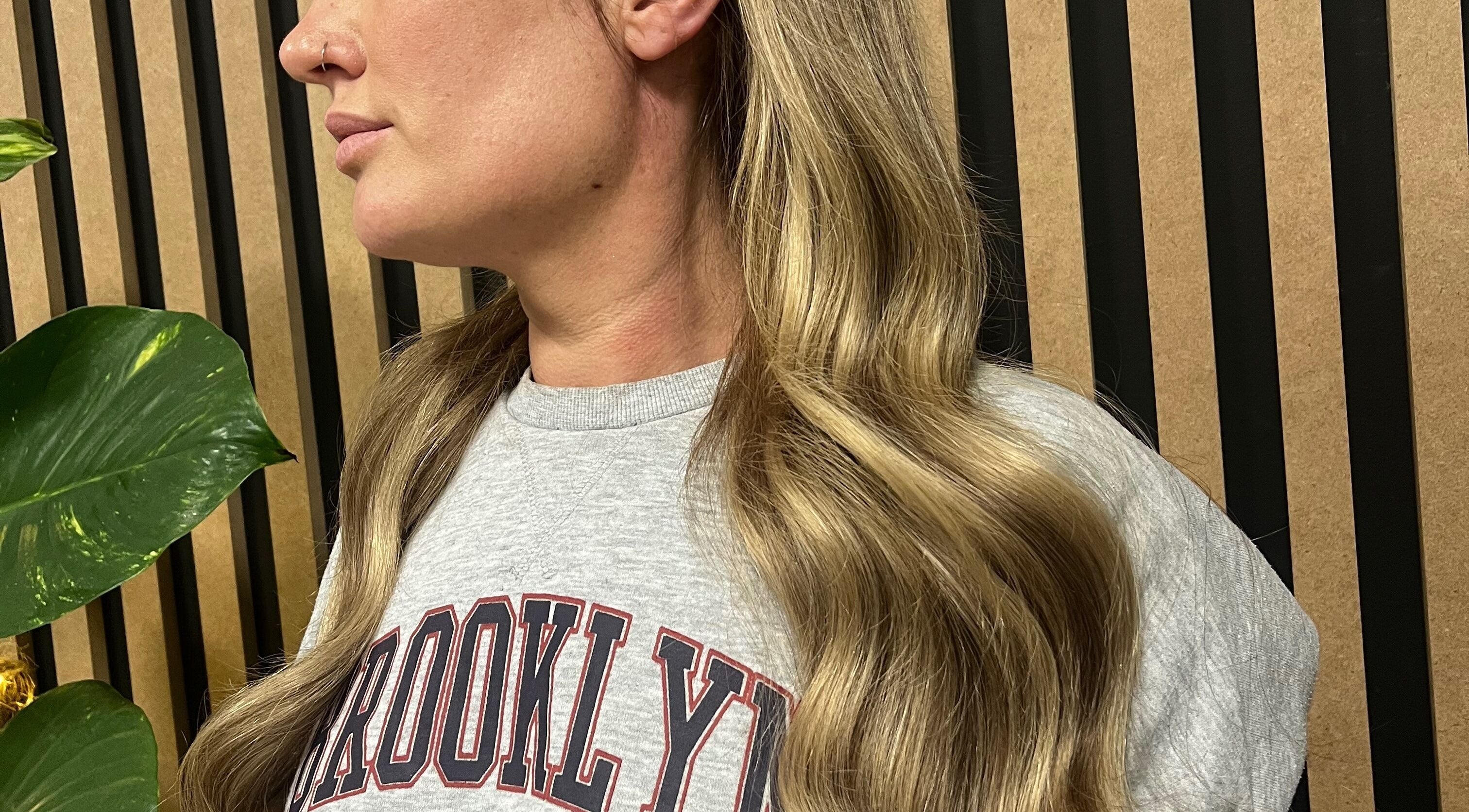 Wavy blonde hair styled at KG Hair, Newport, Wales, GB. Elegant and refined salon look.