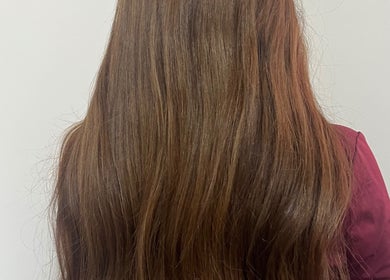Lustrous long brown hair styled at KG Hair in Newport, Wales, GB.