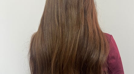 Lustrous long brown hair styled at KG Hair in Newport, Wales, GB.