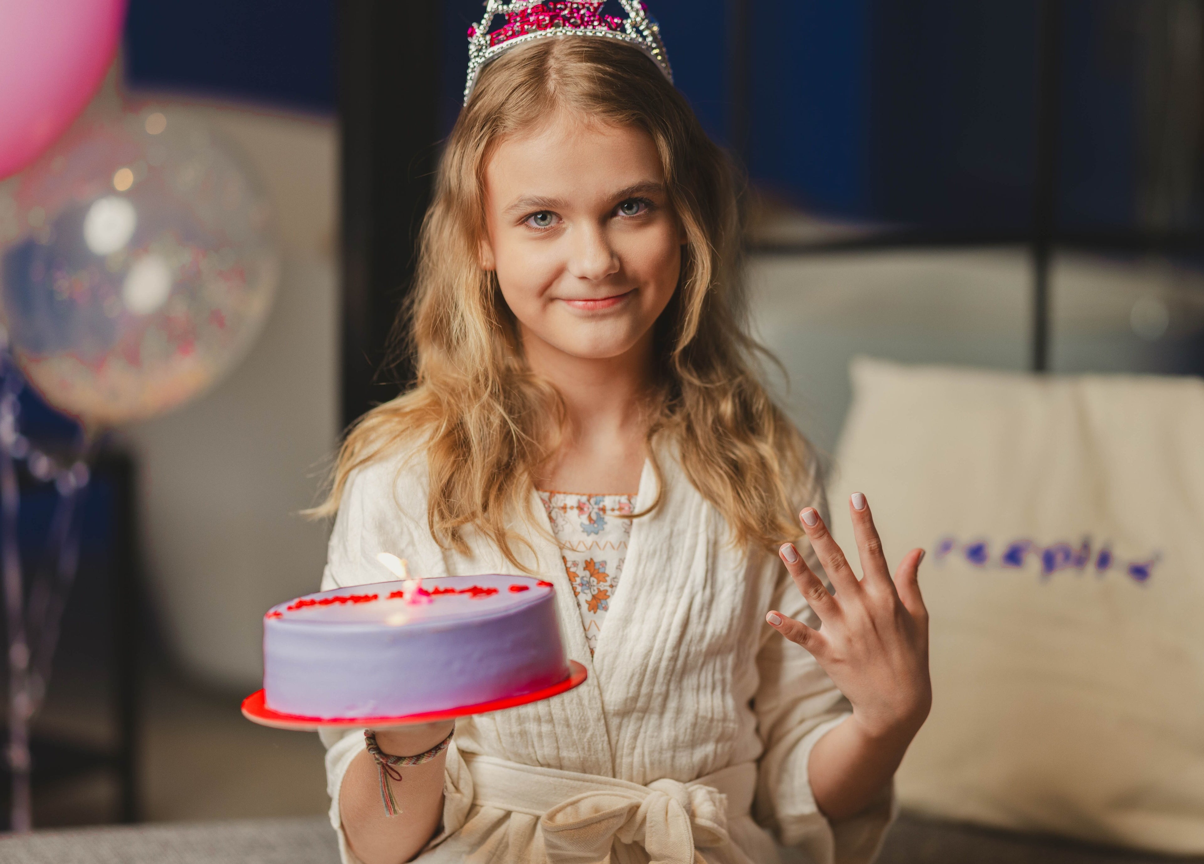 Young girl holding a birthday cake at Respite Care & Spa | Home Services, الرياض, منطقة الرياض, SA.