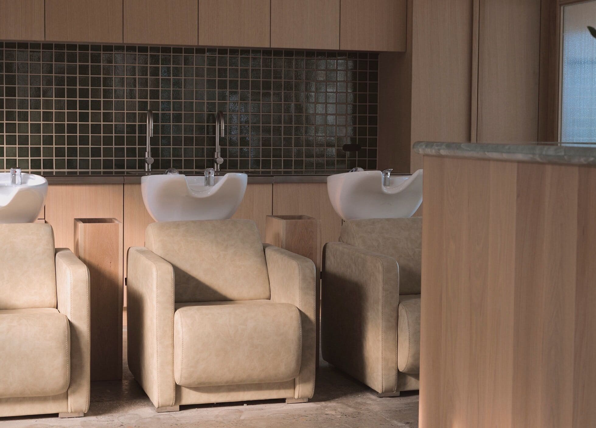 Elegant wash stations at Papillon Hair, Avalon Beach, New South Wales, AU showcasing luxury and comfort.
