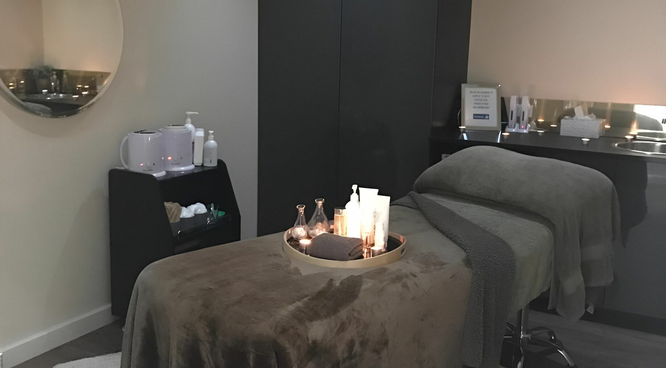 Relaxing therapy room at The Haven Medi Spa, Halls Head, Western Australia, AU, with a cozy treatment table.