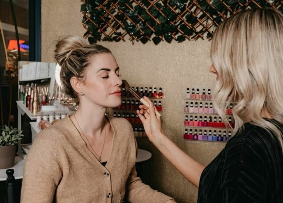 Makeup artist applying blush at The Haven Medi Spa, Halls Head, Western Australia, AU.