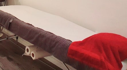 Comfortable massage table at Pupa Beauty Body Treatments in Weeting, England, GB, ready for relaxation therapy.