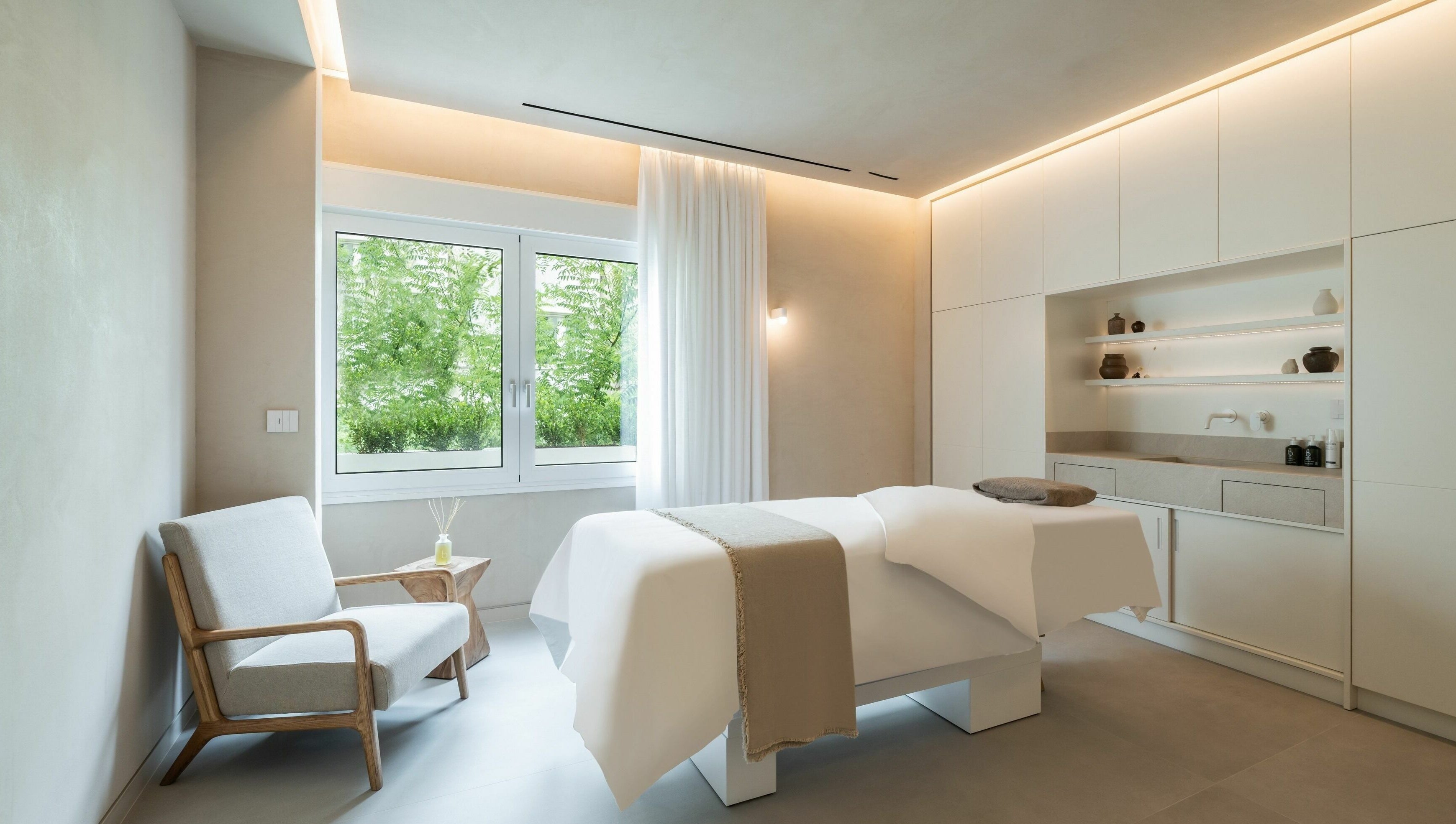 Spa room at Ma Cherie Skin in Αθήνα, GR, featuring a massage bed and serene ambiance with natural light.