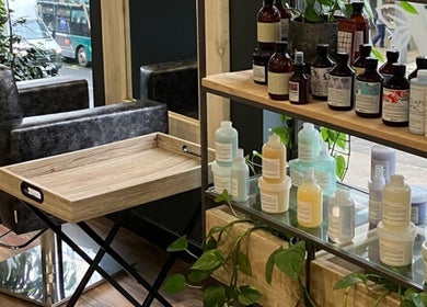 Beauty By Yasemin in Bristol, England showcases premium products neatly arranged on an elegant shelf.