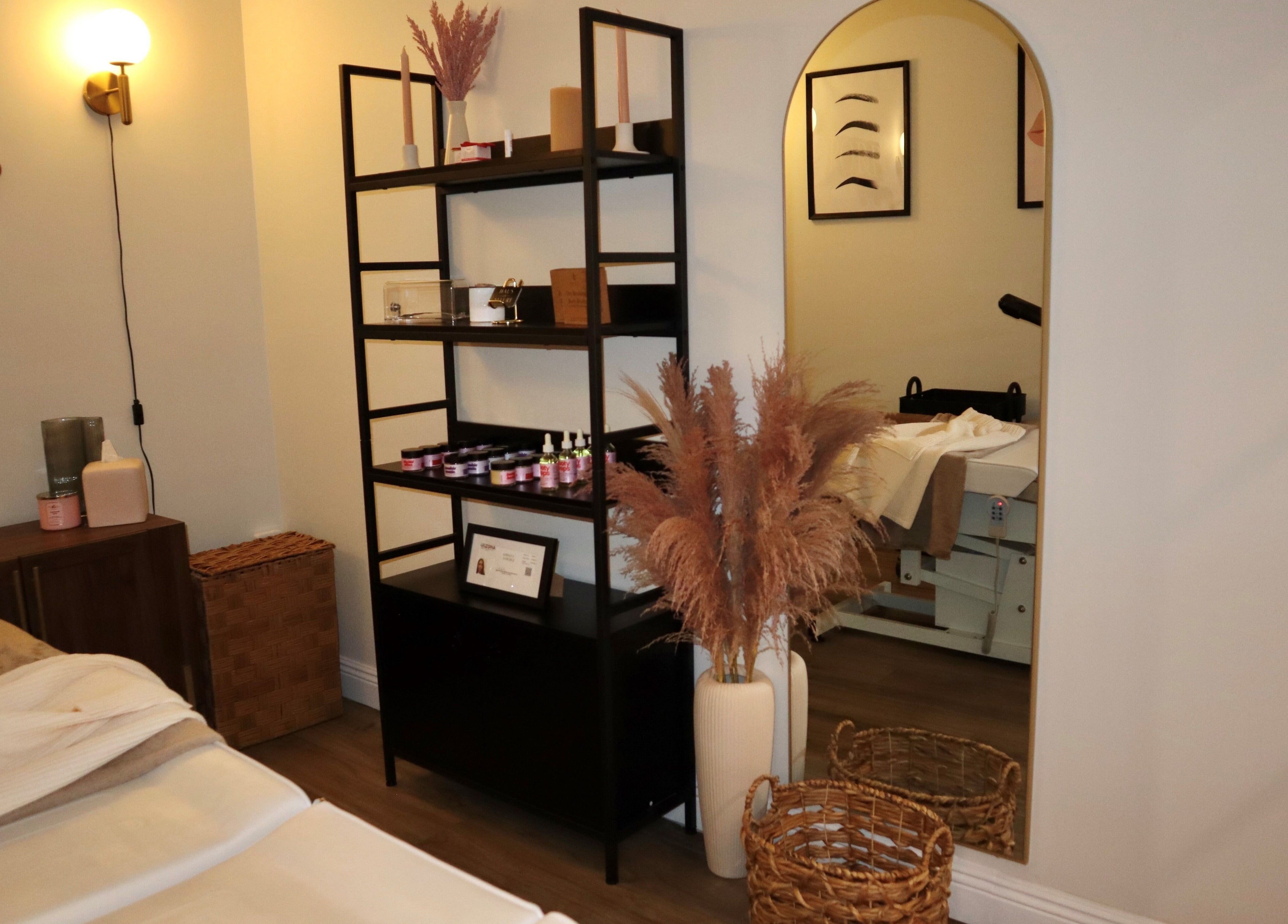 Relaxing spa room at Haus of Allure in Phoenix, Arizona, US, featuring a cozy treatment bed and elegant decor.